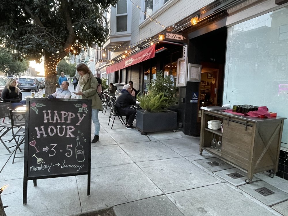 InoVino exterior with happy hour chalkboard